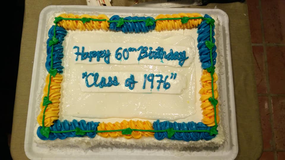 Big 6-0 haupia birthday cake with blue and gold frosting