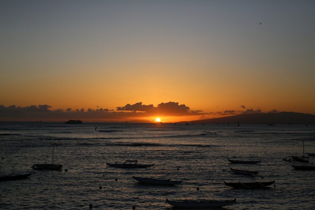 Waikiki sunset with moored canoes