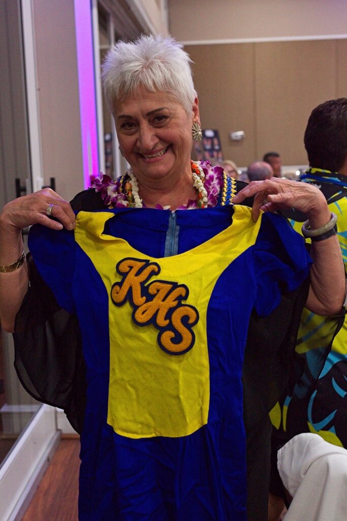 Diva holds her cheerleader uniform