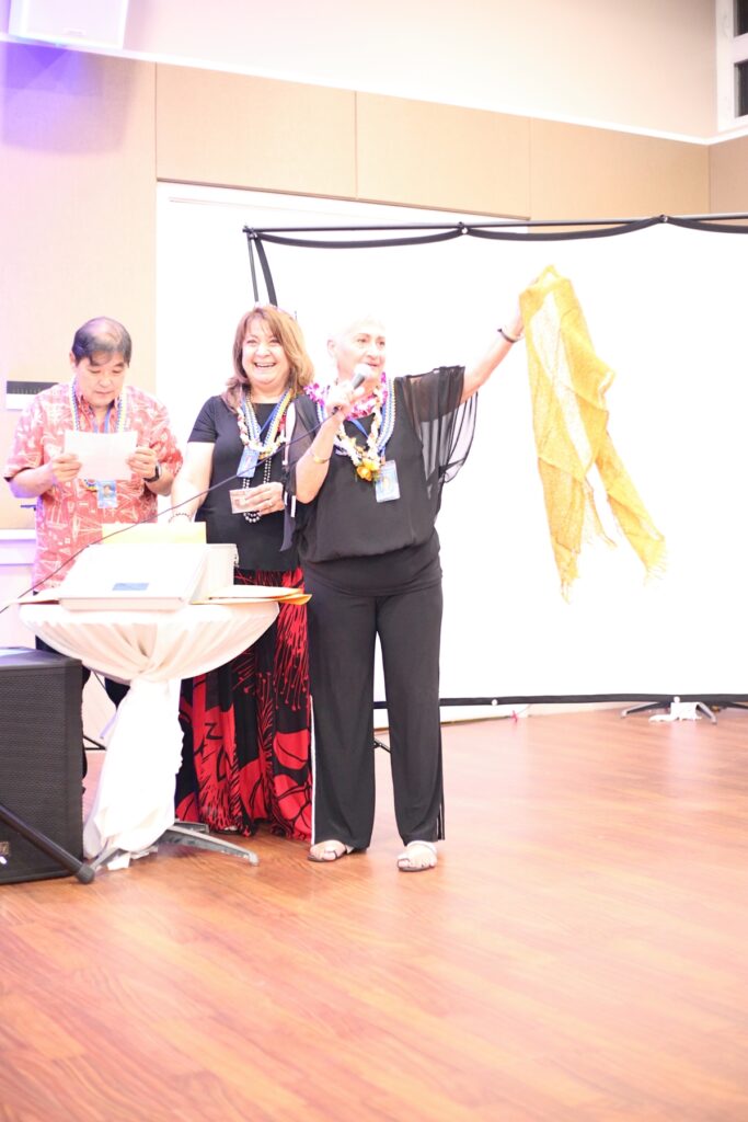 Diva holds up a shawl that she had in the time capsule