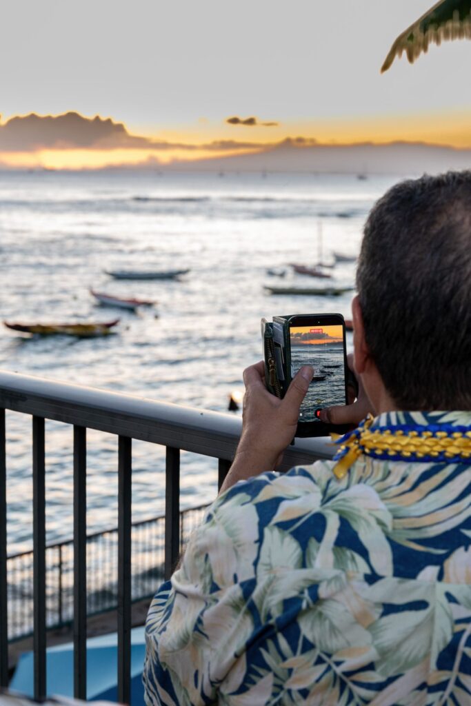 Looking over Mark's shoulder taking a sunset photo