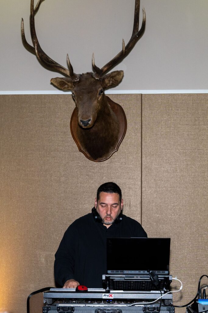 Brandon the DJ under the elk head