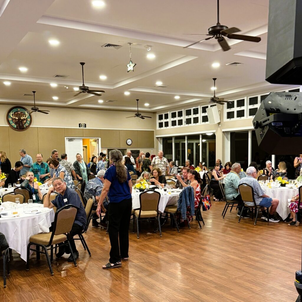 People mingling around the banquet tables